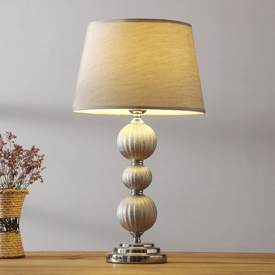 Minimal Silver Bedside Lamp With Ceramic Base And Fabric Shade