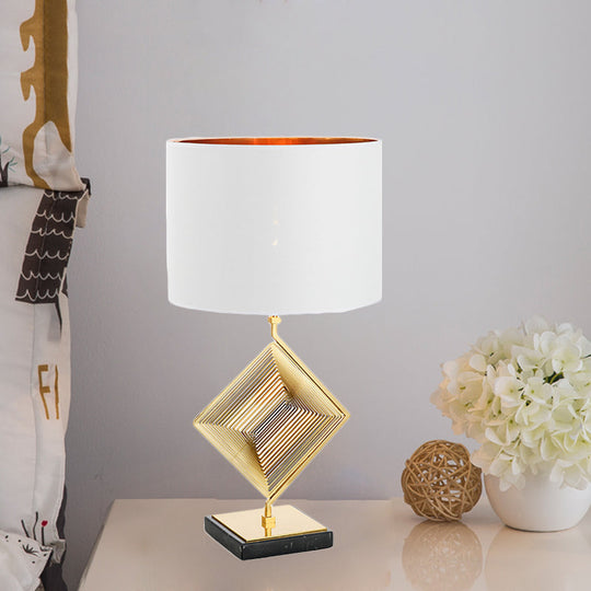 Modern Gold Metal Pyramid Bedside Lamp With White Fabric Shade