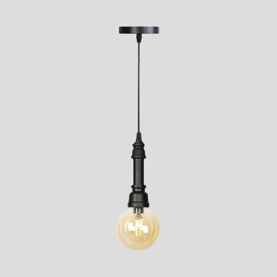 Industrial Black Finish Amber Glass Pendant Lamp with Pipe Suspension - 1-Light Ball/Capsule Ceiling Light