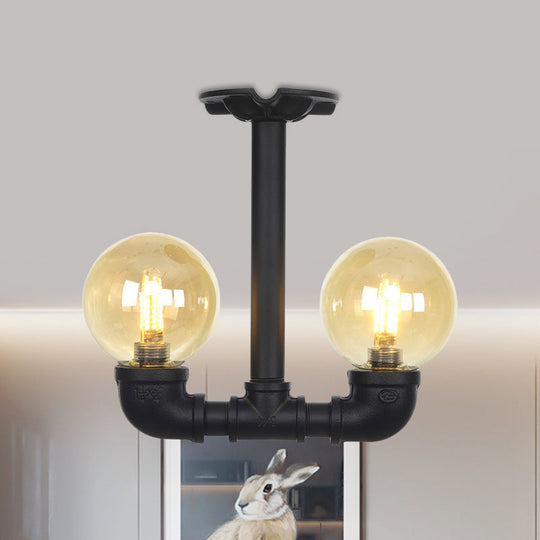 2-Head Semi-Flush Industrial Ball Amber Glass Ceiling Fixture in Black