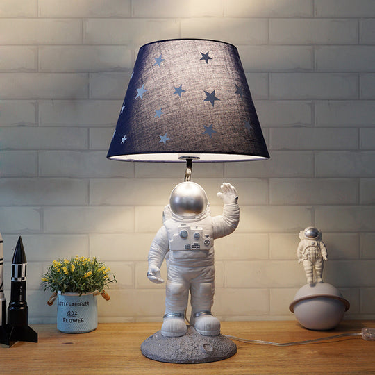 Blue Empire Shade Night Lamp - Kids Star Patterned Fabric Table Lighting With Carved Spaceman Base