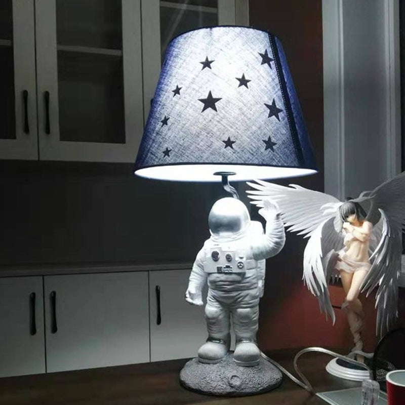 Blue Empire Shade Night Lamp - Kids Star Patterned Fabric Table Lighting With Carved Spaceman Base