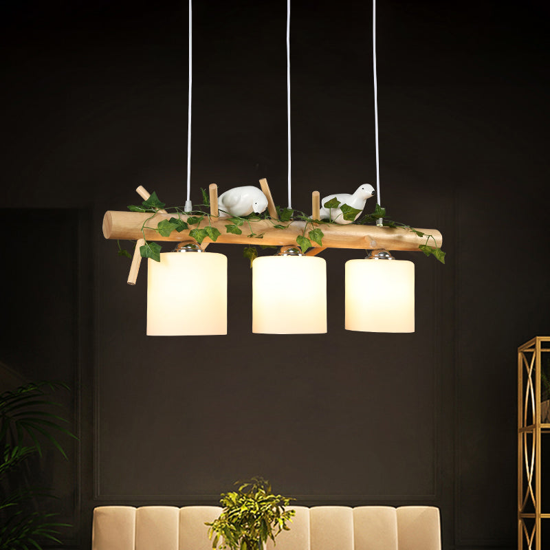 Industrial 3-Light Hanging Pendant For Coffee Shop With Milky Glass Cylinder Wooden Stick And Bird