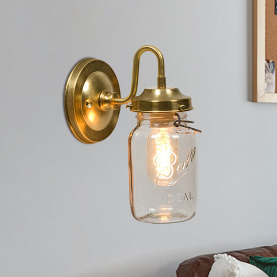 Industrial Clear Glass Wall Sconce With Brass Finish And Letter Detail