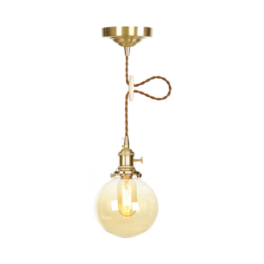 1-Light Amber Pendant Light with Adjustable Cord and Globe Glass Shade - Industrial Indoor Lighting