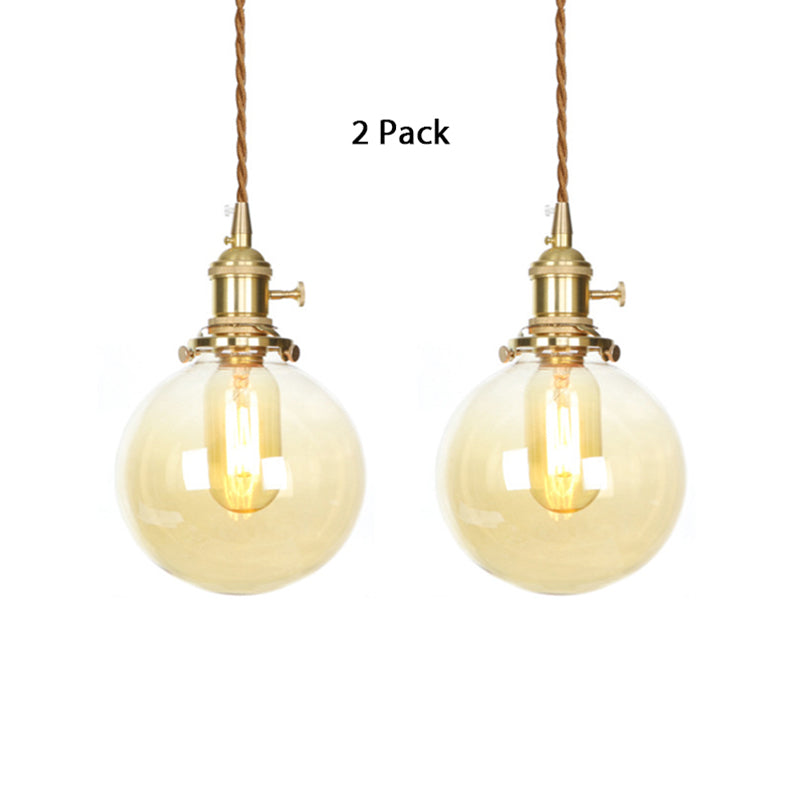 1-Light Amber Pendant Light with Adjustable Cord and Globe Glass Shade - Industrial Indoor Lighting