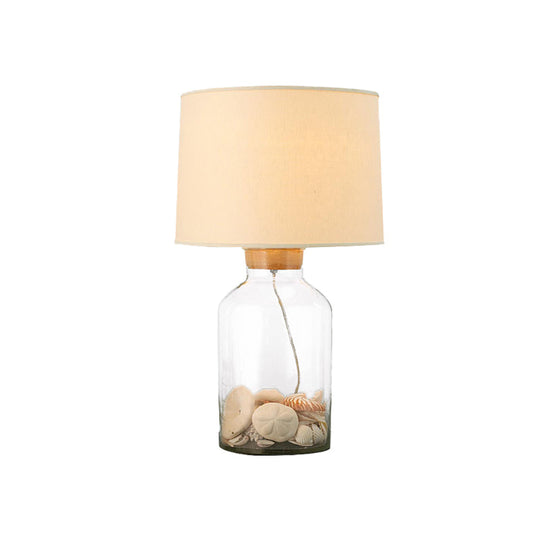 White Traditional Night Table Lamp With Clear Glass Base And Fabric Barrel Shade