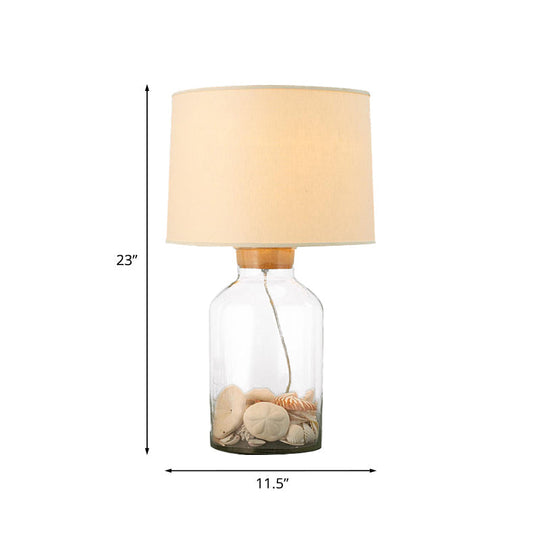 White Traditional Night Table Lamp With Clear Glass Base And Fabric Barrel Shade