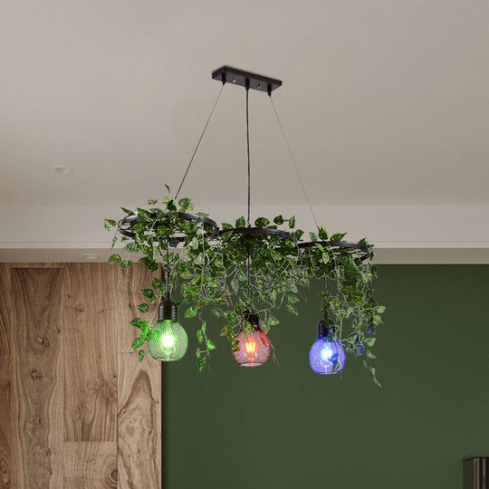 Black Iron Wheel 3-Head Pendant Light with Green Vine Detail and Globe Cage Design