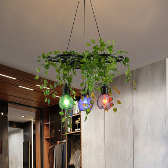 Black Iron Wheel 3-Head Pendant Light with Green Vine Detail and Globe Cage Design