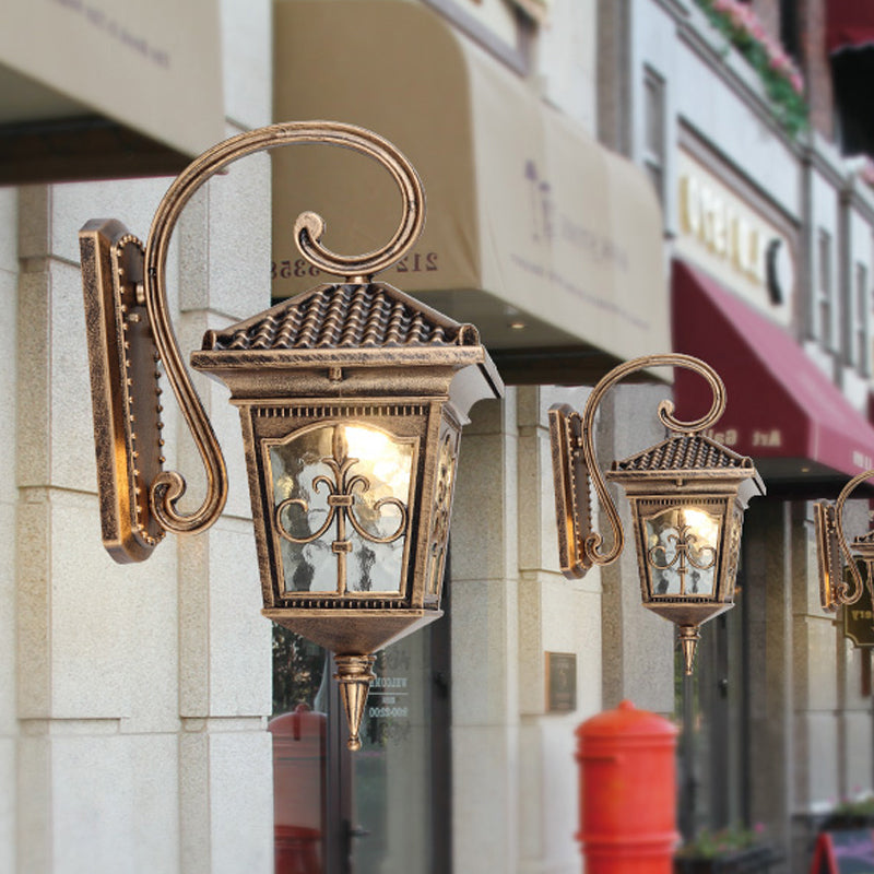 Vintage Pavilion 1-Light Sconce In Black/Bronze With Curvy Arm And Clear Water Glass Bronze