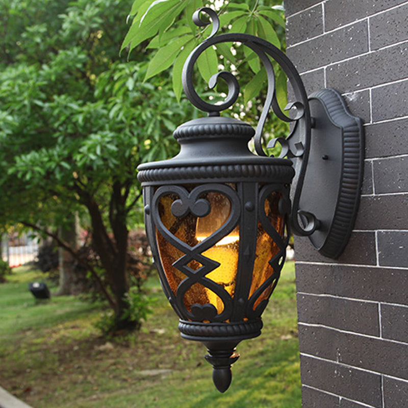 Courtyard Wall Light Fixture: Elegant Urn Shape One Amber Glass Black Mount