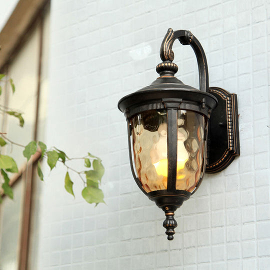 Farmhouse Clear Dimple Glass Wall Lamp - 1 Light Courtyard Lighting In Black With Curved Arm