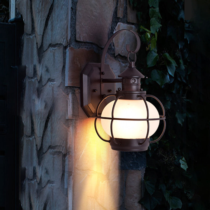 Retro Coffee/Bronze Lantern Wall Light With Wire Cage - Outdoor 1 Head Lighting In White/Clear Glass