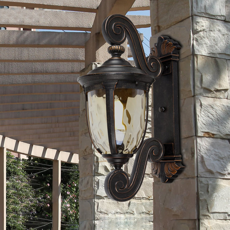 Traditional Amber Water Glass Sconce With Brown-Black Urn Shade - Elegant Wall Lighting