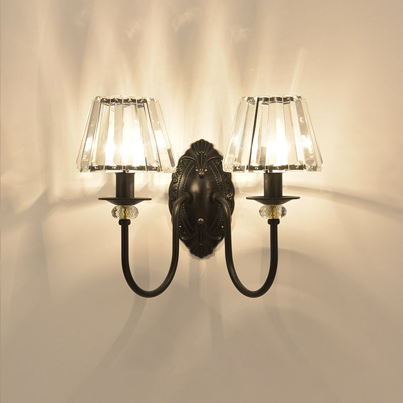 Post-Modern Black Metal Wall Mount Light With Clear Crystal Shade - Trapezoid/Flower/Drum Design