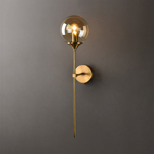 Brass Globe Shade Wall Sconce - Modern Single Bulb Clear/Grey/Amber Glass Light For Bedroom