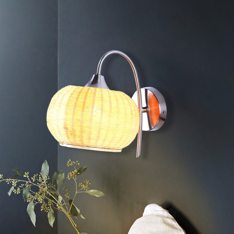 Modern Rattan Drum Sconce Wall Light - Chrome Finish 1-Light Lamp With Curved Metal Arm