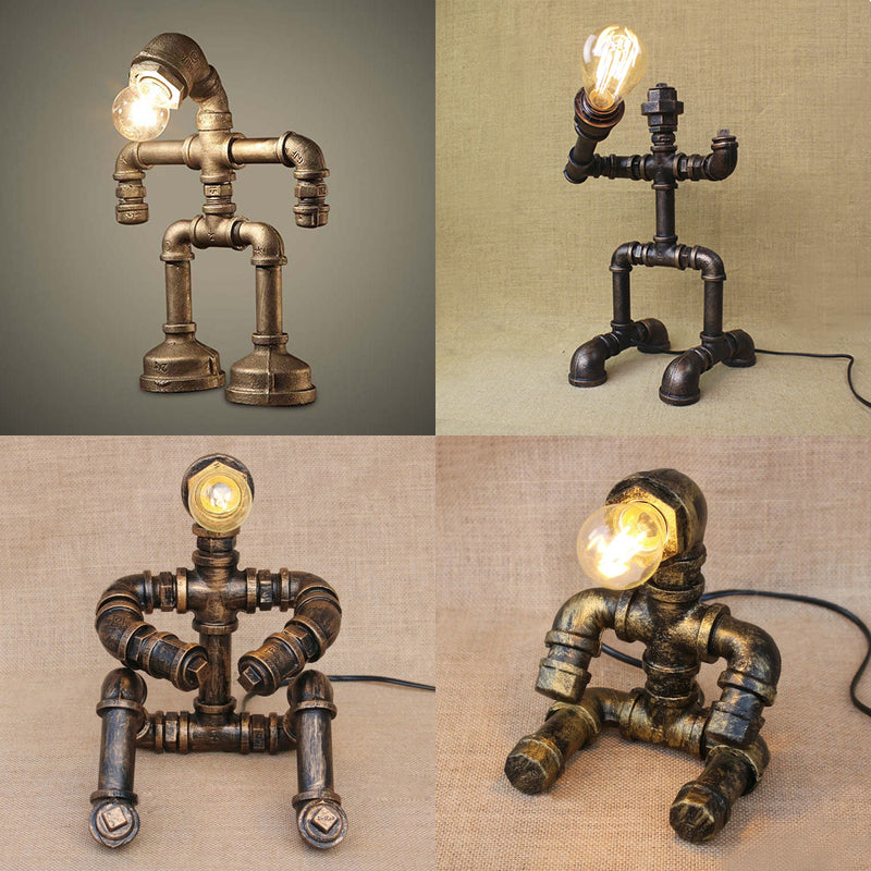 Vintage Stylish Sitting Robot Wrought Iron Table Lamp With Antique Brass Plumbing Pipe