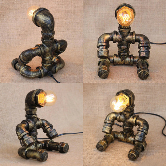 Vintage Stylish Sitting Robot Wrought Iron Table Lamp With Antique Brass Plumbing Pipe